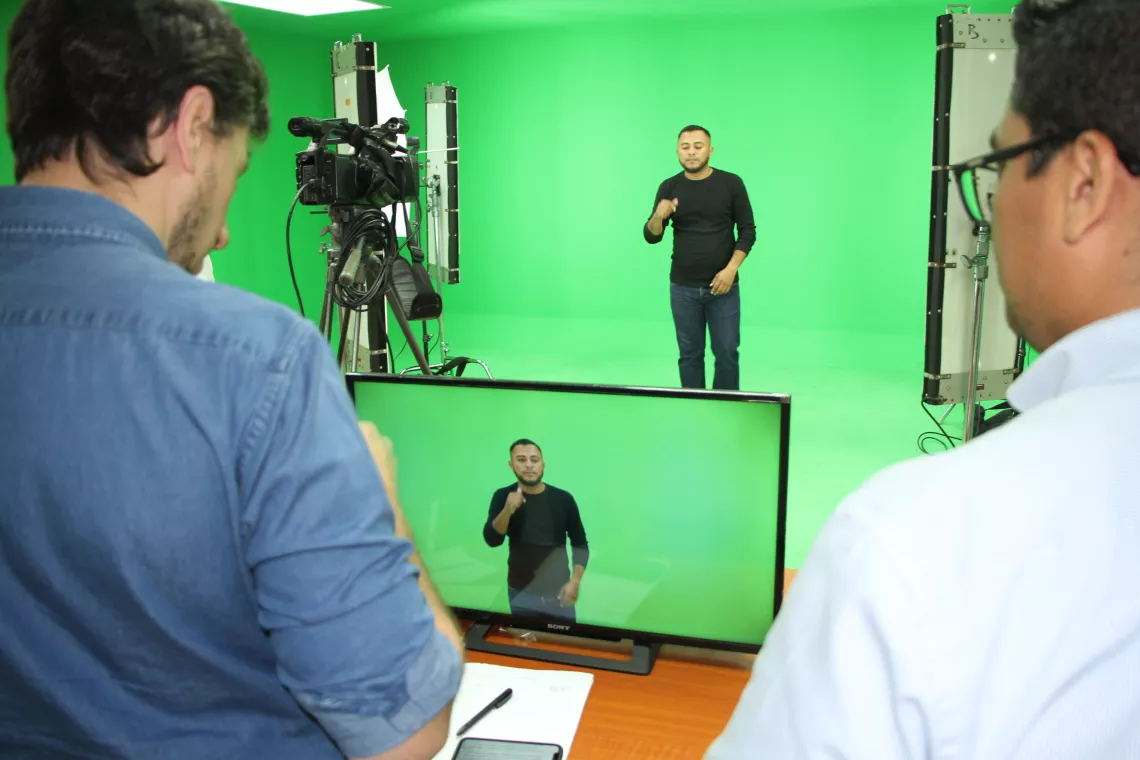 Sign language recording in front of green screen